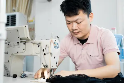 seasoned seamster focuses on sewing the custom black lingerie